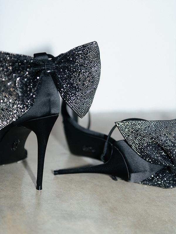 Black heels with an embellished bow