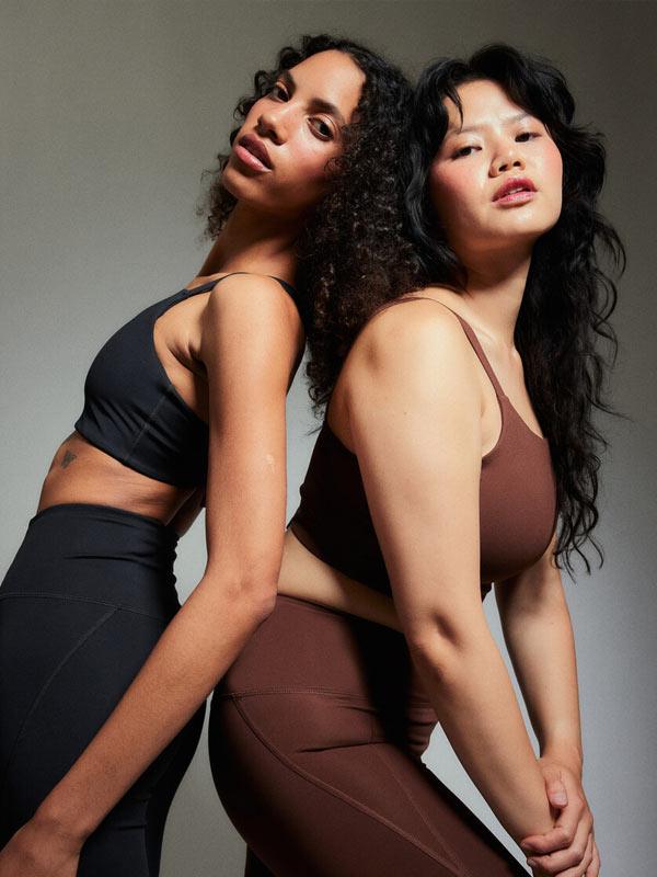 Two women in Girlfriend Collective activewear from Fenwick.