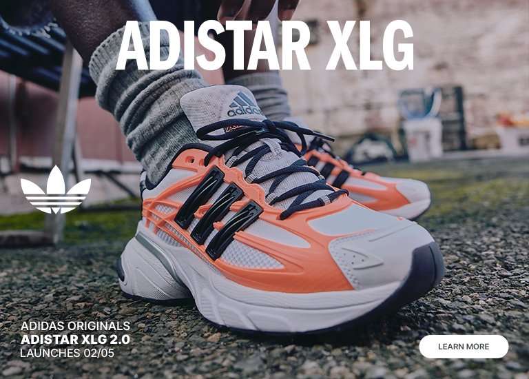 Banner showing two models wearing adidas Originals apparel and Adistar XLG sneakers, with close-up shoe detail and text promoting Adistar XLG 2.0 launches 02/05 and Learn More.