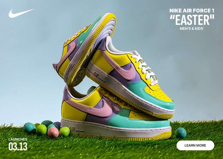 An advertisement for the Nike Air Force 1 Easter sneakers, featuring a stack of three multi-colored patent leather shoes in pastel yellow, purple, pink, and teal. The sneakers are displayed on green grass alongside speckled Easter eggs against a light blue background. Text indicates a March 13 launch for men's and kids' sizes.