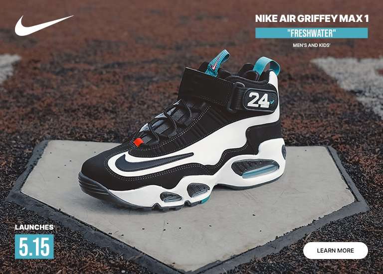 A Nike Air Griffey Max 1 Freshwater sneaker in black, white, and teal sits on a baseball home plate over a dirt field. The image features a white Nike swoosh in the top left, the launch date 5.15 in the bottom left, product details in the top right, and a LEARN MORE button in the bottom right.