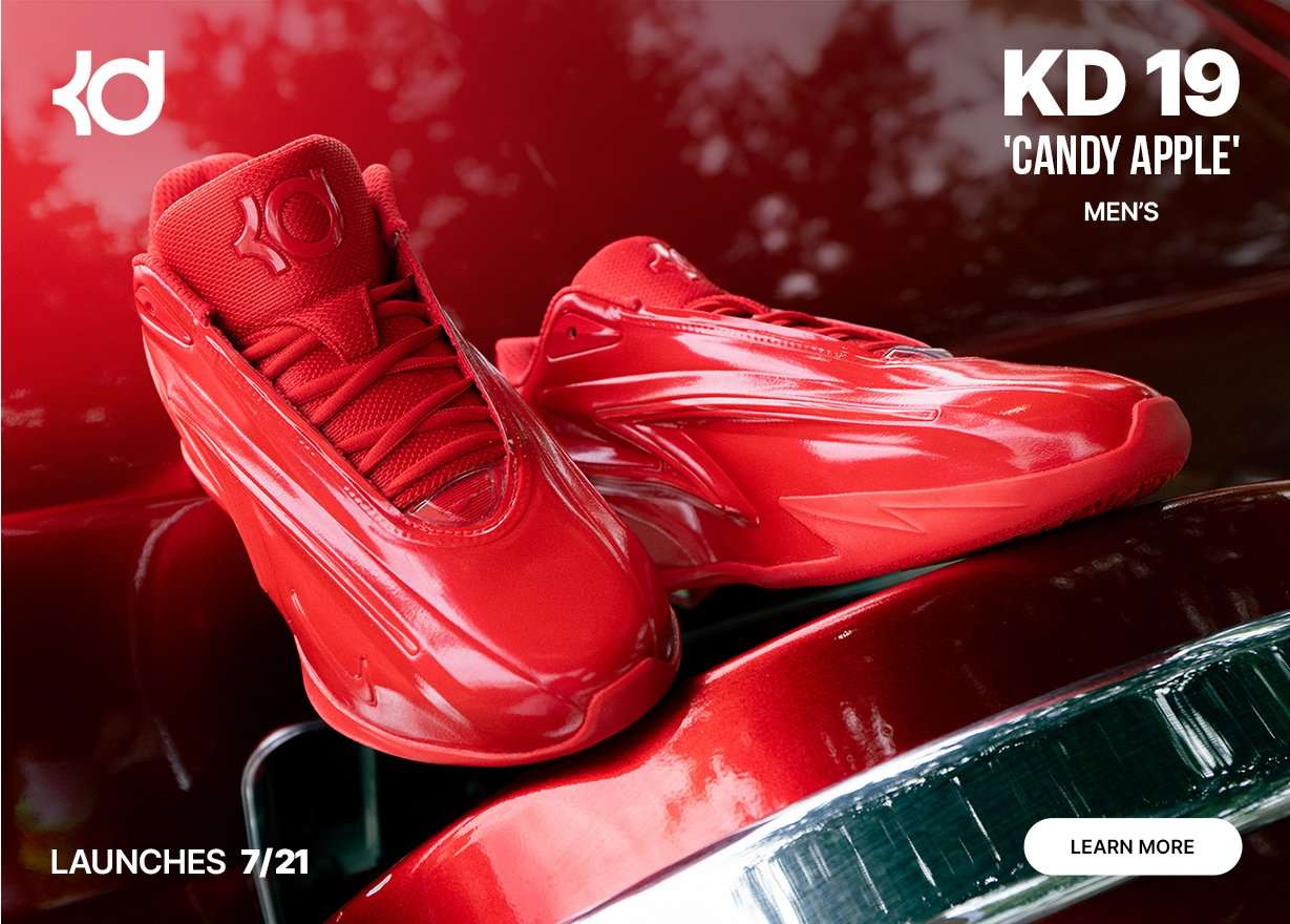 Nike KD 19 Candy Apple basketball shoes in a bold red colorway displayed on a matching red vehicle, highlighting the upcoming launch.