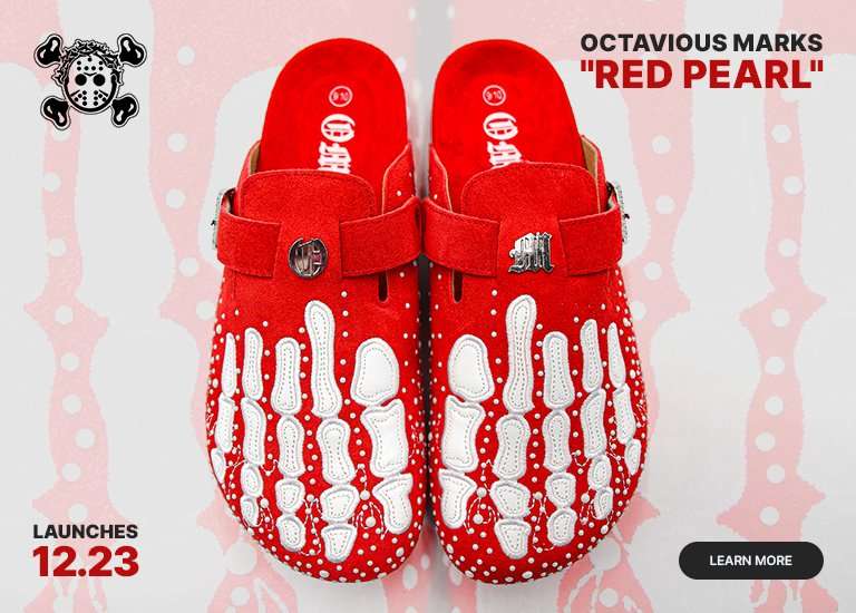 A display showing top and side views of red suede clogs featuring white skeletal hand graphics and rhinestone details. The text LAUNCHES 12.23 is in the corner with a LEARN MORE button.