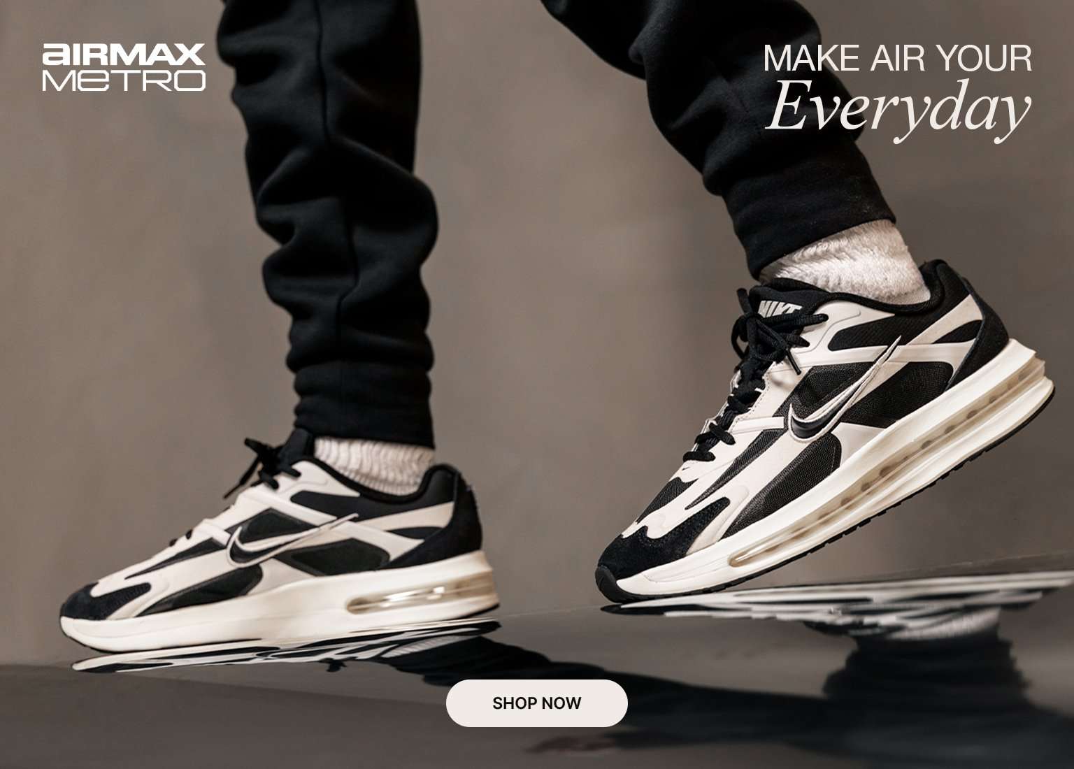 Black and white Nike Air Max Metro sneakers with layered detailing and visible Air cushioning.