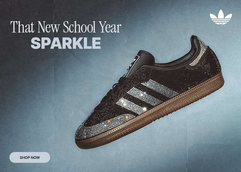 Black rhinestone adidas Samba sneaker with sparkling crystal details and gum sole on a blue background.
