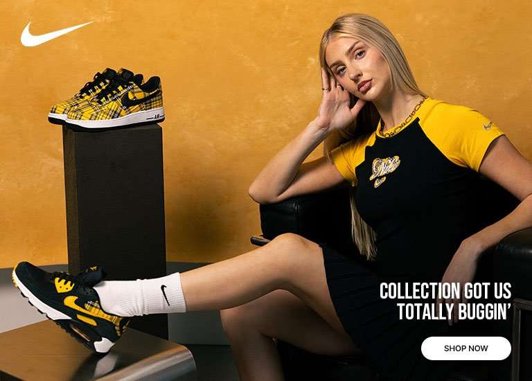 Nike sneaker collection featuring yellow-and-black plaid Nike Air Force 1 and Air Max shoes styled with a black-and-yellow Nike graphic top, white crew socks, and coordinated apparel against a golden backdrop.