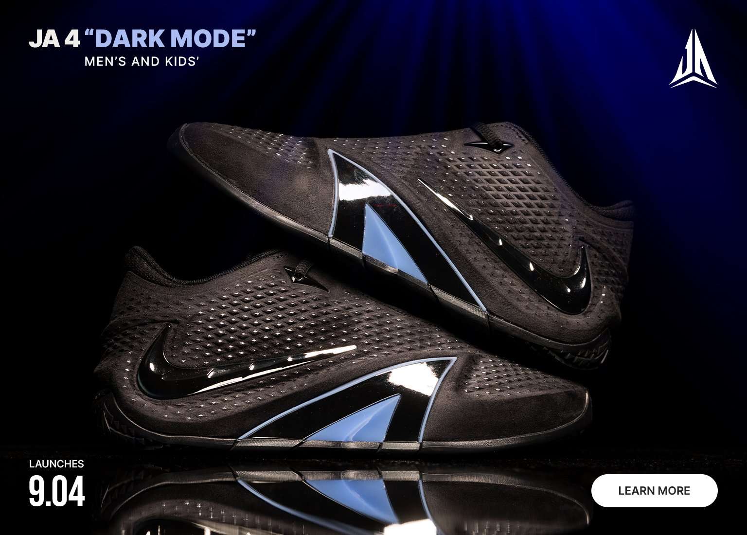 Pair of Nike JA 4 Dark Mode basketball shoes in black with glossy black Swooshes and reflective silver-blue midfoot panels, displayed against a dark blue background.