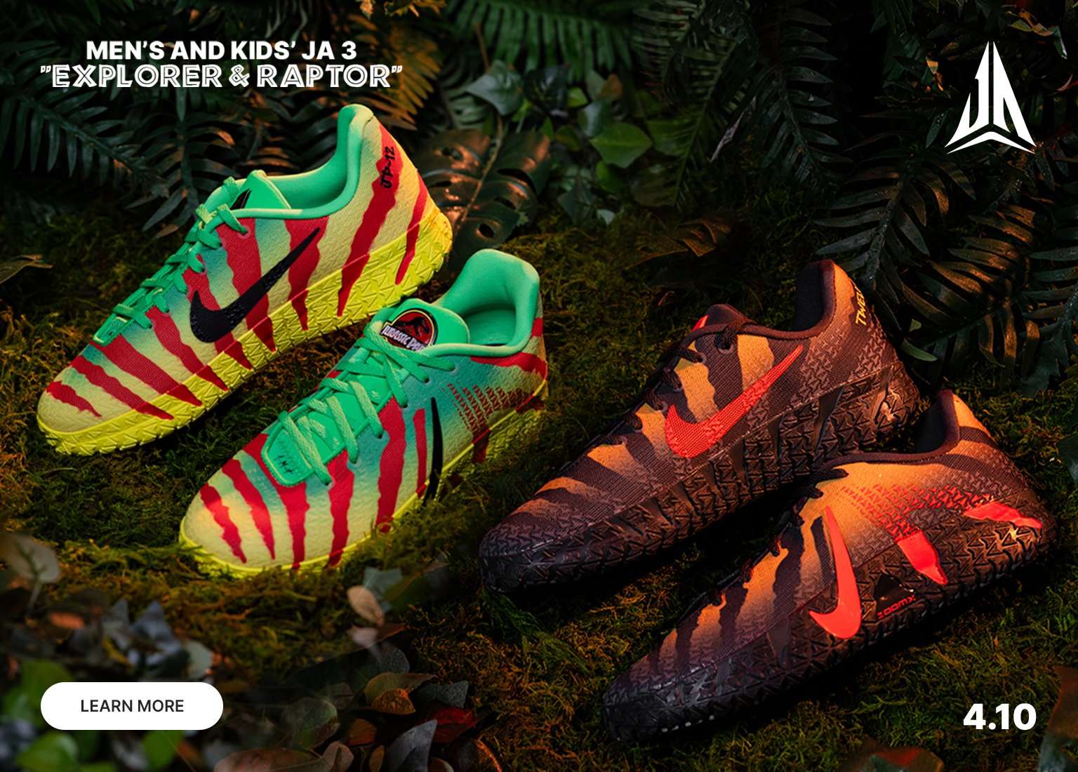 A promotional banner for Men’s and Kids’ Nike Ja 3 Explorer & Raptor sneakers, featuring a Jurassic Park-inspired theme. Two pairs of shoes with dinosaur-inspired patterns are displayed on a mossy, jungle-like background with tropical ferns. Text includes Learn More and a release date of 4.10.