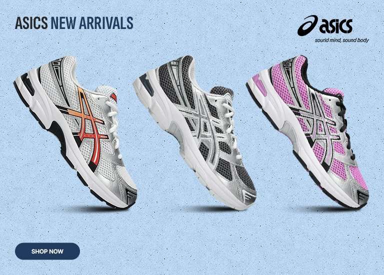 A row of four kids' Asics 1130 sneakers in different colorways—orange/white, black/white, grey/silver, and pink/silver—displayed against a blue gradient background with an Asics logo and Shop Now button.