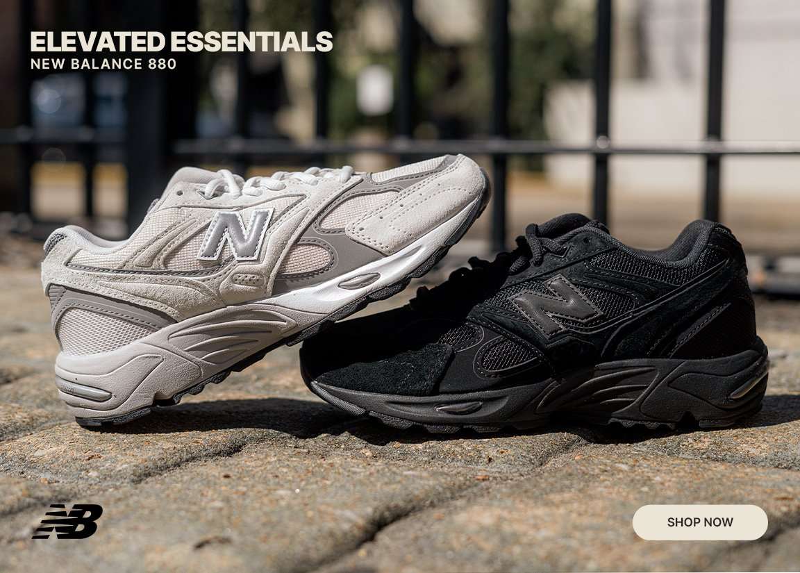 New Balance 880 sneakers in neutral and black colorways displayed outdoors on stone pavement.