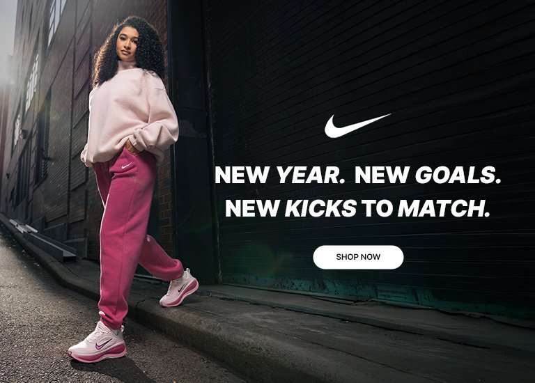 Nike running campaign featuring a woman in a pink sweatshirt and joggers wearing pink-and-white Nike running shoes, with text reading New Year. New Goals. New Kicks to Match.