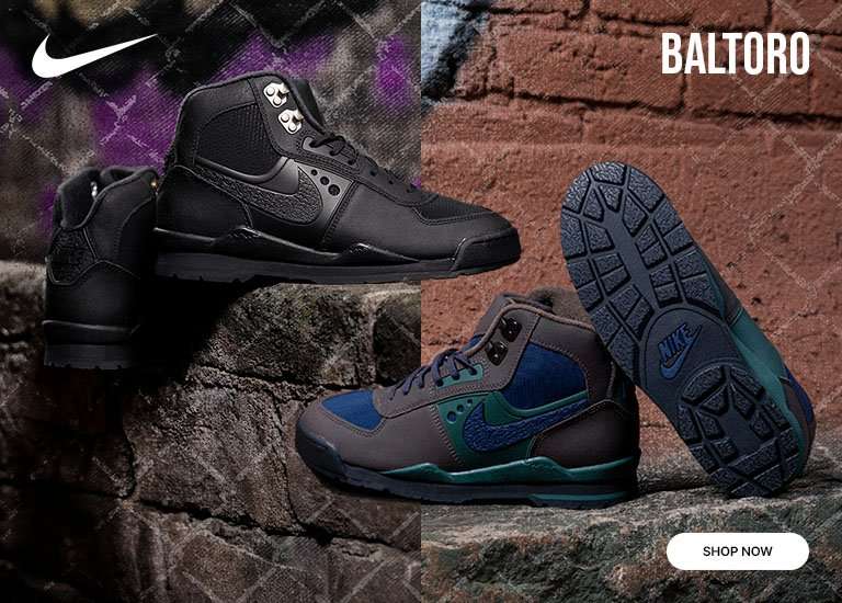 Nike Baltoro hiking boots in black and blue colorways displayed on rugged stone surfaces, highlighting durable construction, textured outsoles, and trail-ready design.