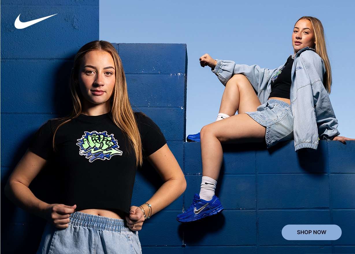 Nike denim jacket and shorts set paired with a graphic crop tee and blue Nike sneakers.