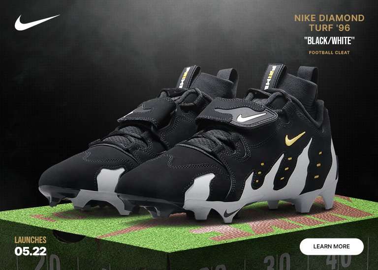 Nike launch banner against a smoky black background featuring black and white Diamond Turf 96 cleats. Text highlights a May 22 launch date with a learn more button.