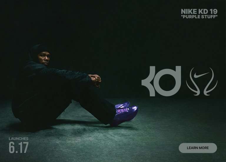 A dark promotional banner for the Nike KD 19 Purple Stuff sneaker launch. On the left, basketball player Kevin Durant sits on the floor wearing all-black clothing, looking towards the camera while wearing vibrant, metallic purple basketball shoes. On the right, the large gray KD logo and a stylized Nike swoosh graphic are displayed alongside text that reads NIKE KD 19 PURPLE STUFF. The bottom left corner indicates a launch date of 6.17, and a Learn More button sits in the bottom right corner.