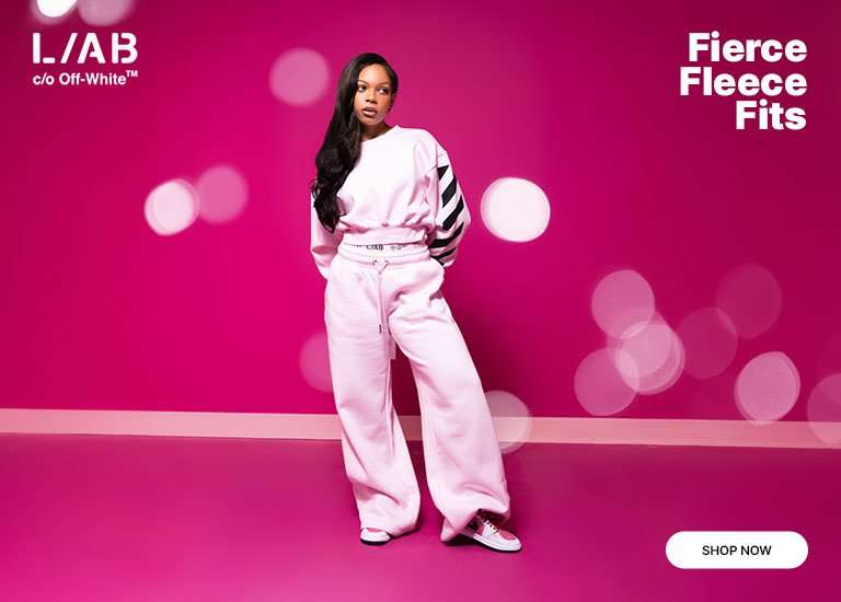 Model wearing a pink Off-White fleece set with black graphic details.