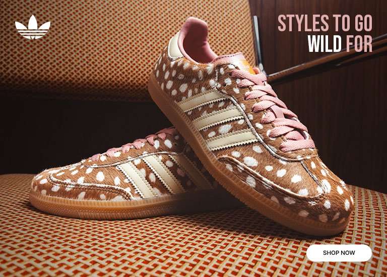 Adidas Samba OG Deer Print sneakers with a spotted faux-fur design displayed on a patterned chair.