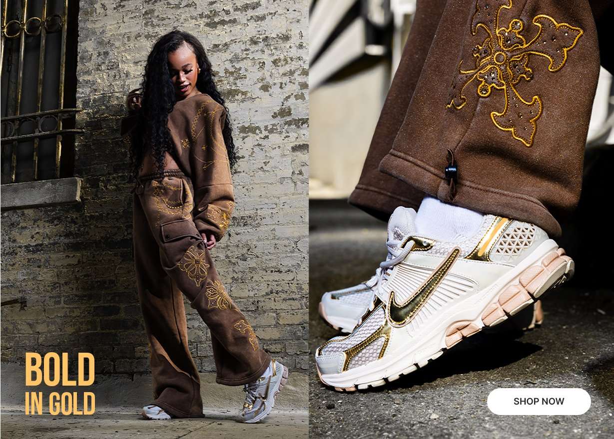 Model wearing a brown embroidered matching set with white and gold sneakers.