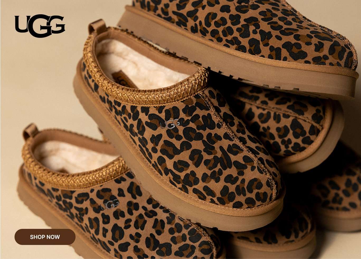 Leopard-print UGG Tasman slip-on slippers with plush lining and platform sole.
