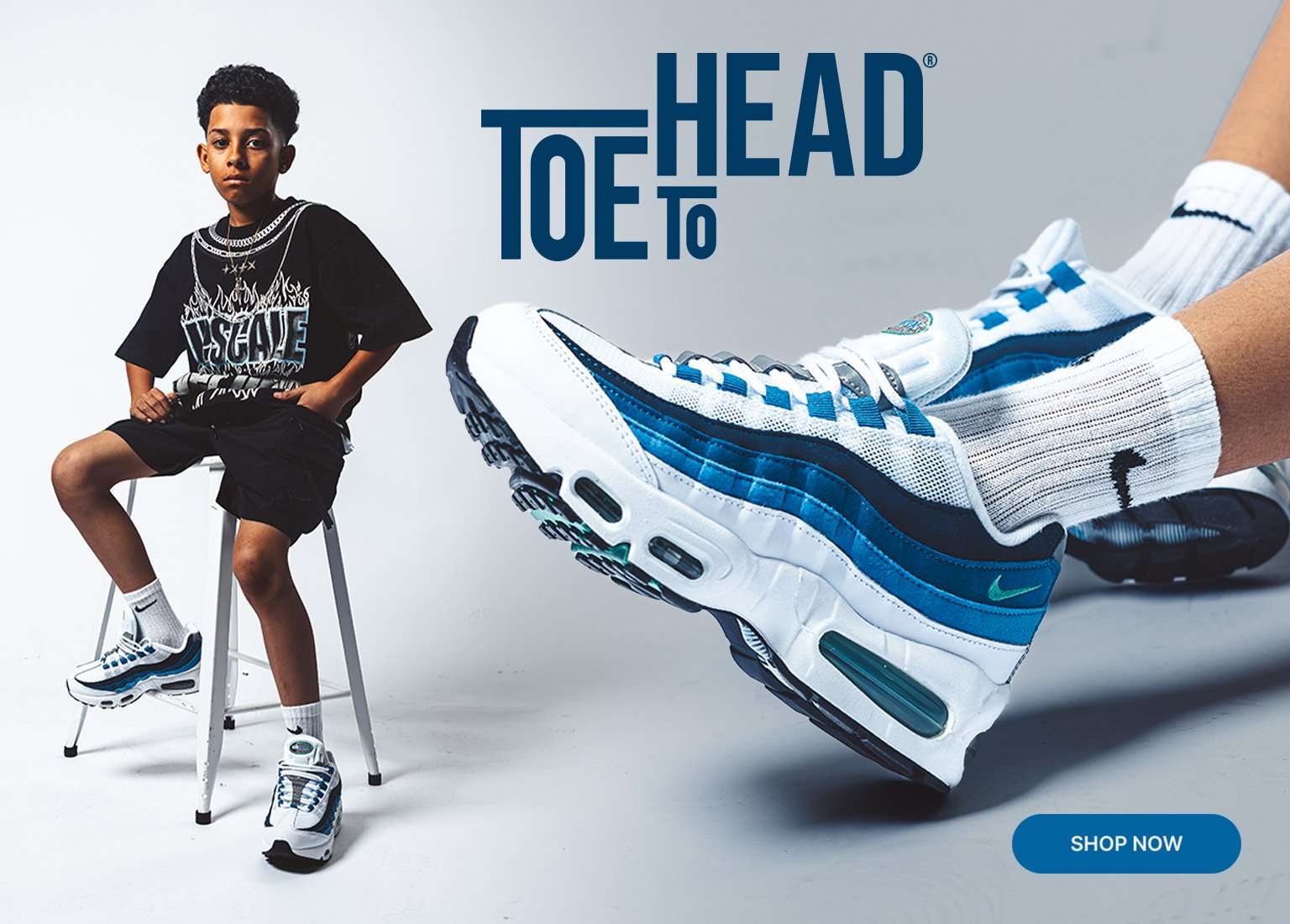 Promotional banner featuring a boy sitting on a stool alongside a close-up of white, blue, and black Nike Air Max 95 shoes. Text reads Toe to Head with a blue shop now button at the bottom right.