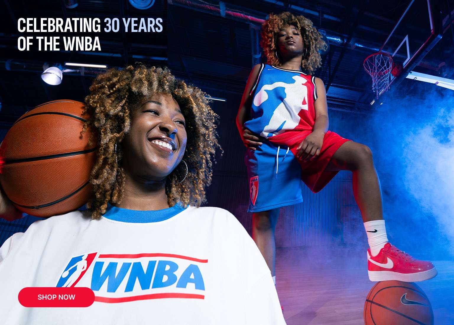A promotional banner celebrating 30 years of the WNBA featuring a woman in a basketball gym. She wears a white WNBA t-shirt and color-blocked shorts, paired with red and white Nike Air Force 1 sneakers. A red shop now button is visible in the bottom right corner.
