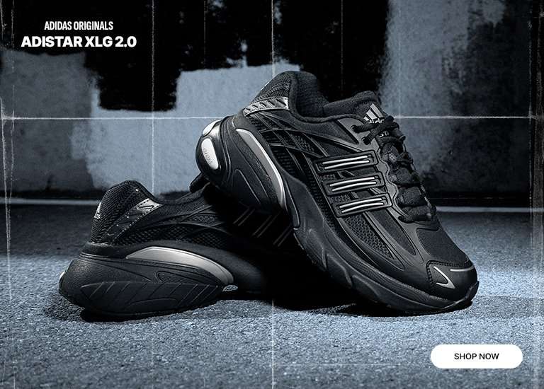 Graphic for adidas Originals Adistar XLG 2.0 shoes. The image shows a pair of black and silver sneakers on an asphalt surface with a Shop Now button in the corner.
