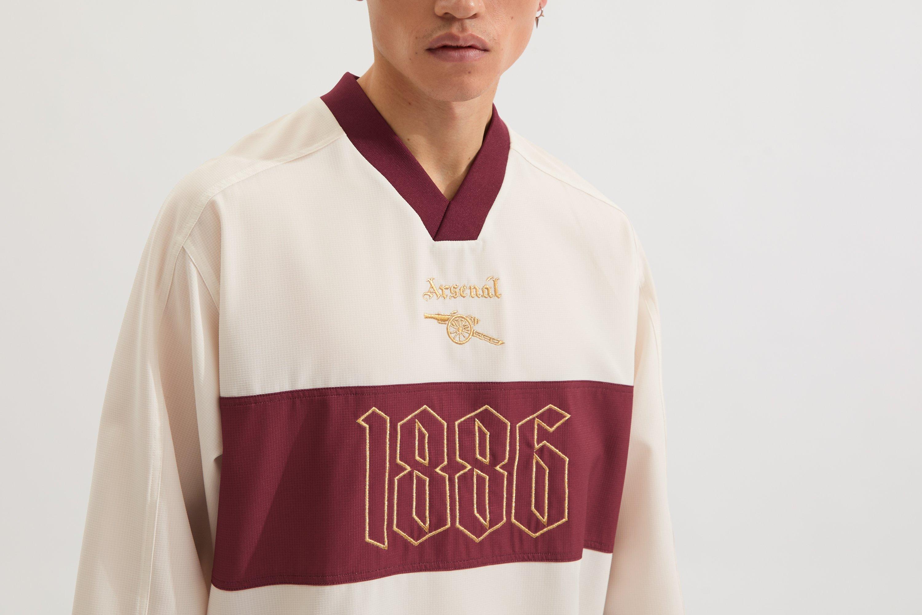Arsenal North London Classic White Shell Top | Official Online Store