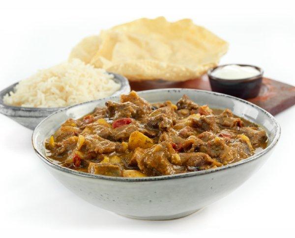Bowl of Goat stew and rice