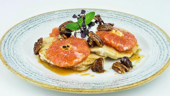 Pancakes with Pink Grapefruit, Warm Maple Syrup, Pecans & Dates