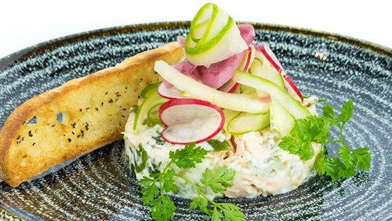Hot smoked salmon and cucumber with pickled vegetable salad