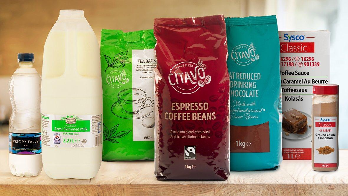 A selection of coffee products, including beans, grounds, and brewing equipment on a counter.