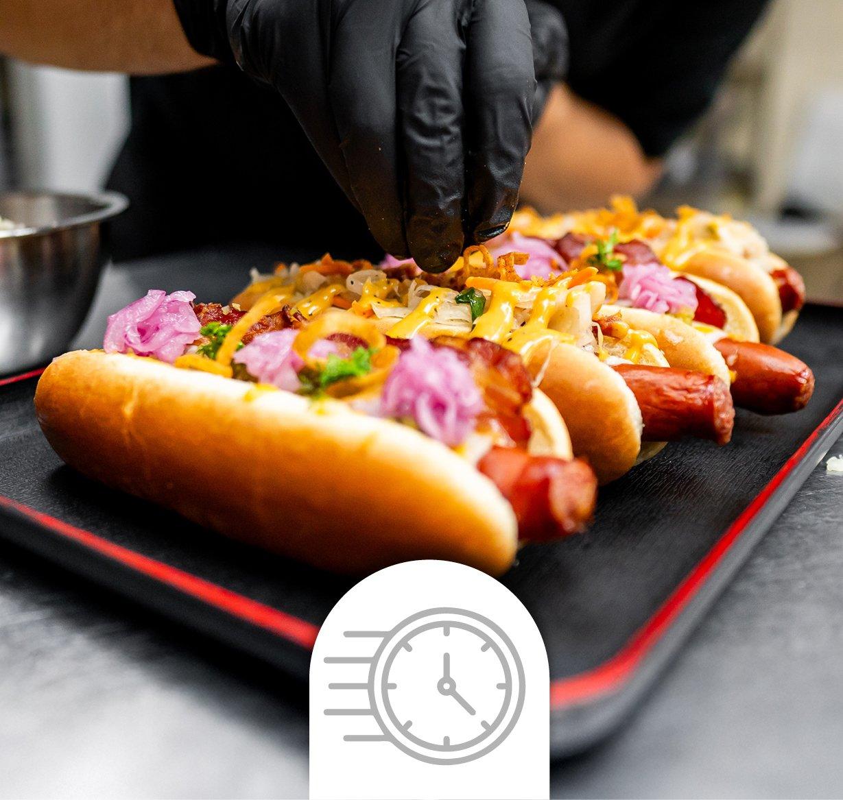 Hot dogs being prepared in quick service restaurant