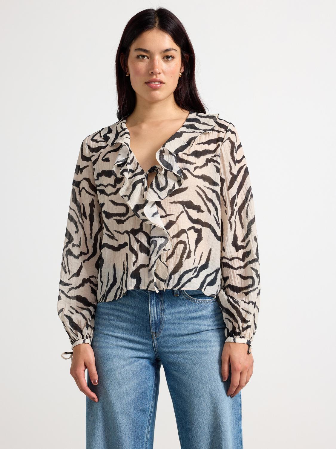Blus med volanger