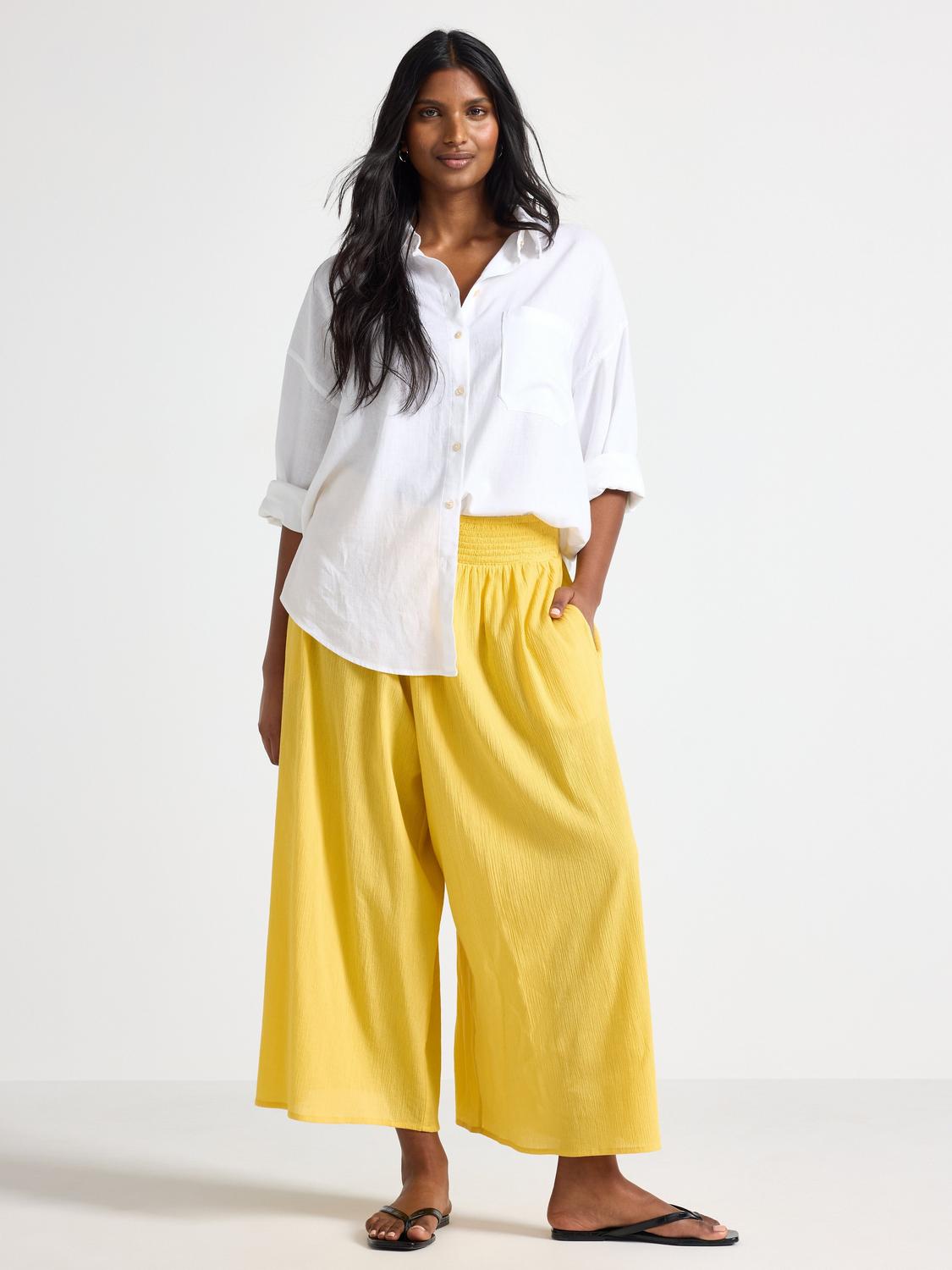 Croppade byxor med vida ben