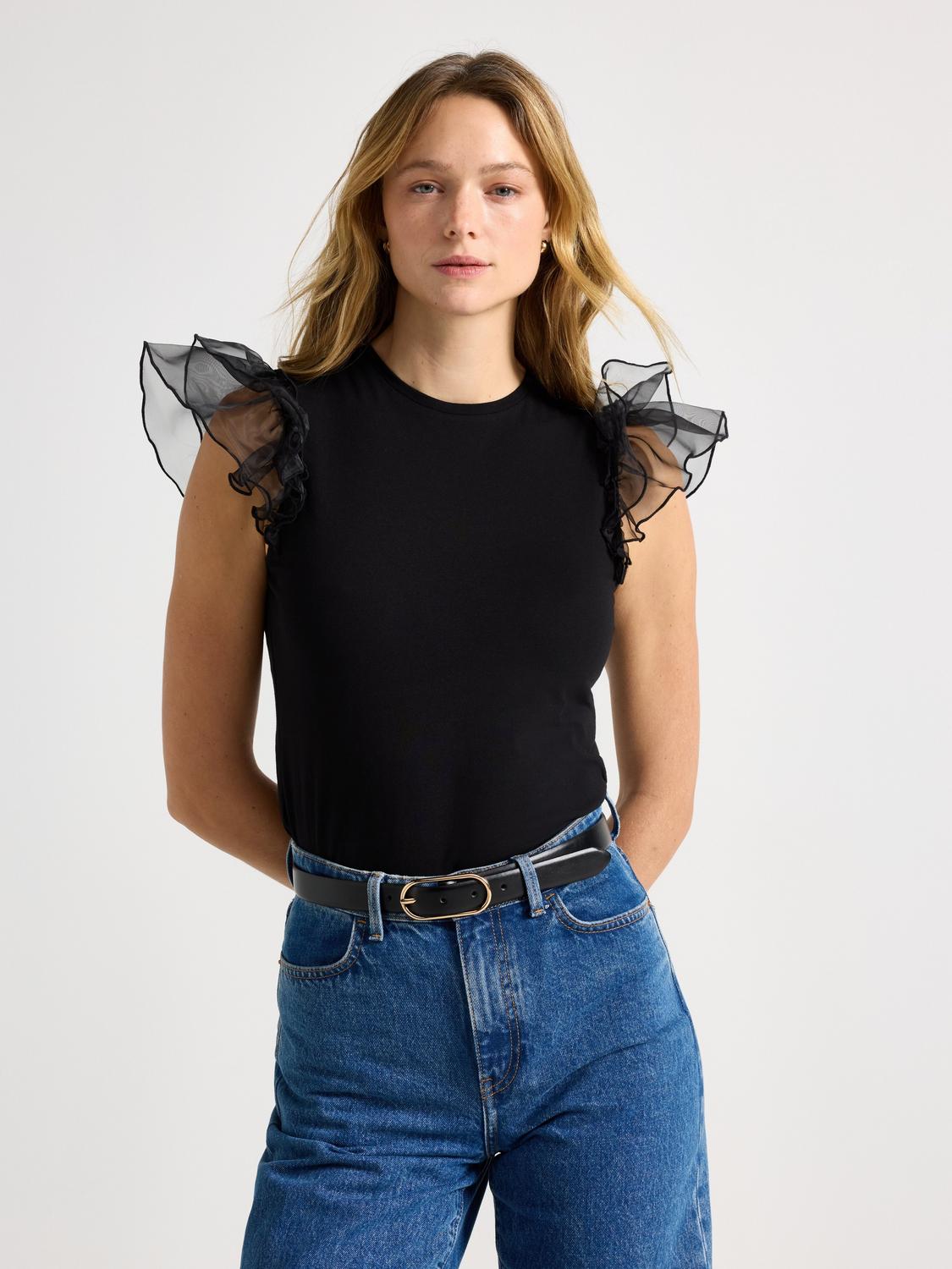 Topp med dekorerad axel