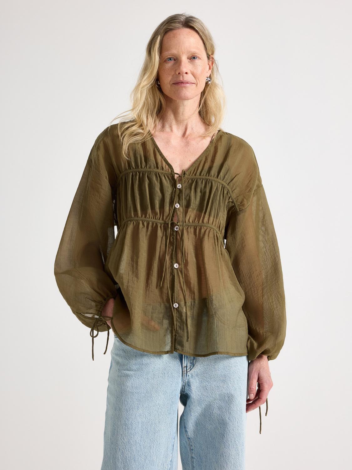 Blus med knytband