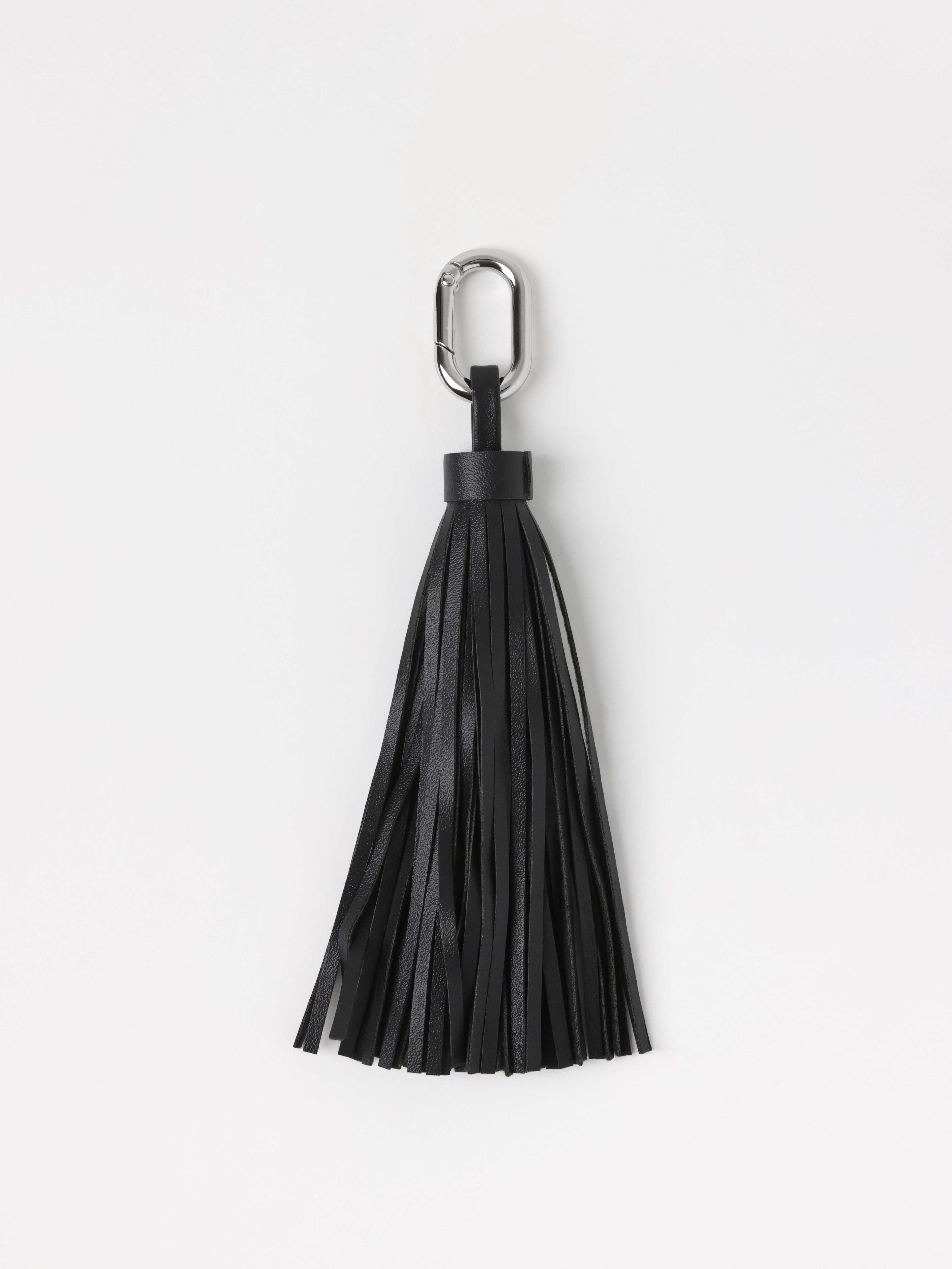 Tassel i läderimitation