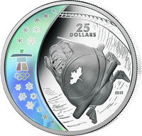 Vancouver 2021: sichelf&ouml;rmiges Farb-Hologramm mit dem Emblem "Vancouver 2010" in originaler Kolorierung