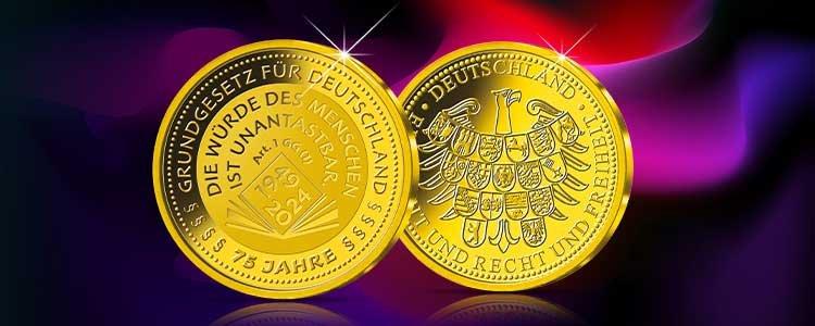 Deal der Woche mit Goldmünze „75 Jahre Grundgesetz“ auf pink-violettem Hintergrund, gültig vom 23.03. bis 29.03.2026.