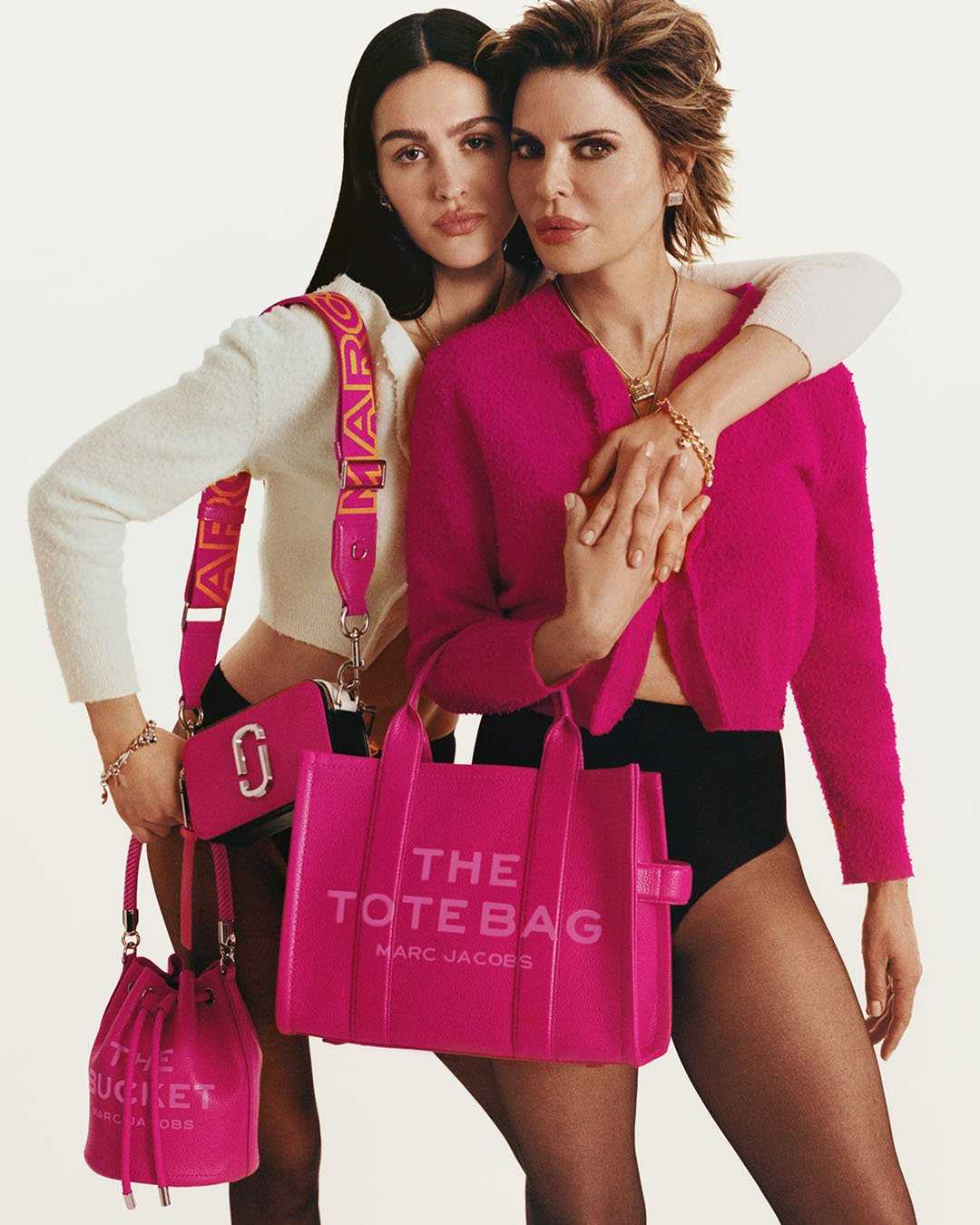 Lisa and Amelia with hot pink totes