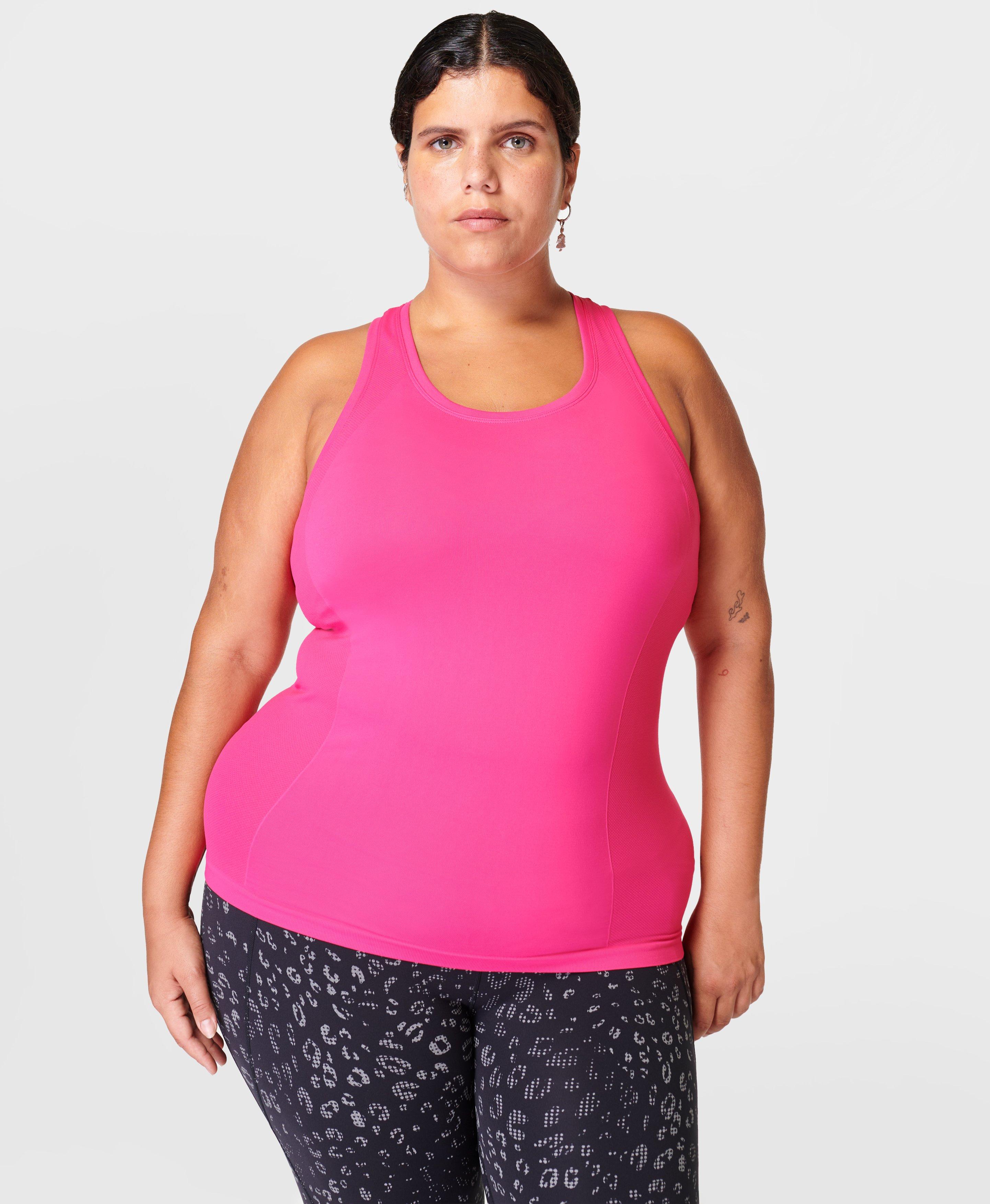 Pink sports tank top with thin crossed straps in stretch lycra