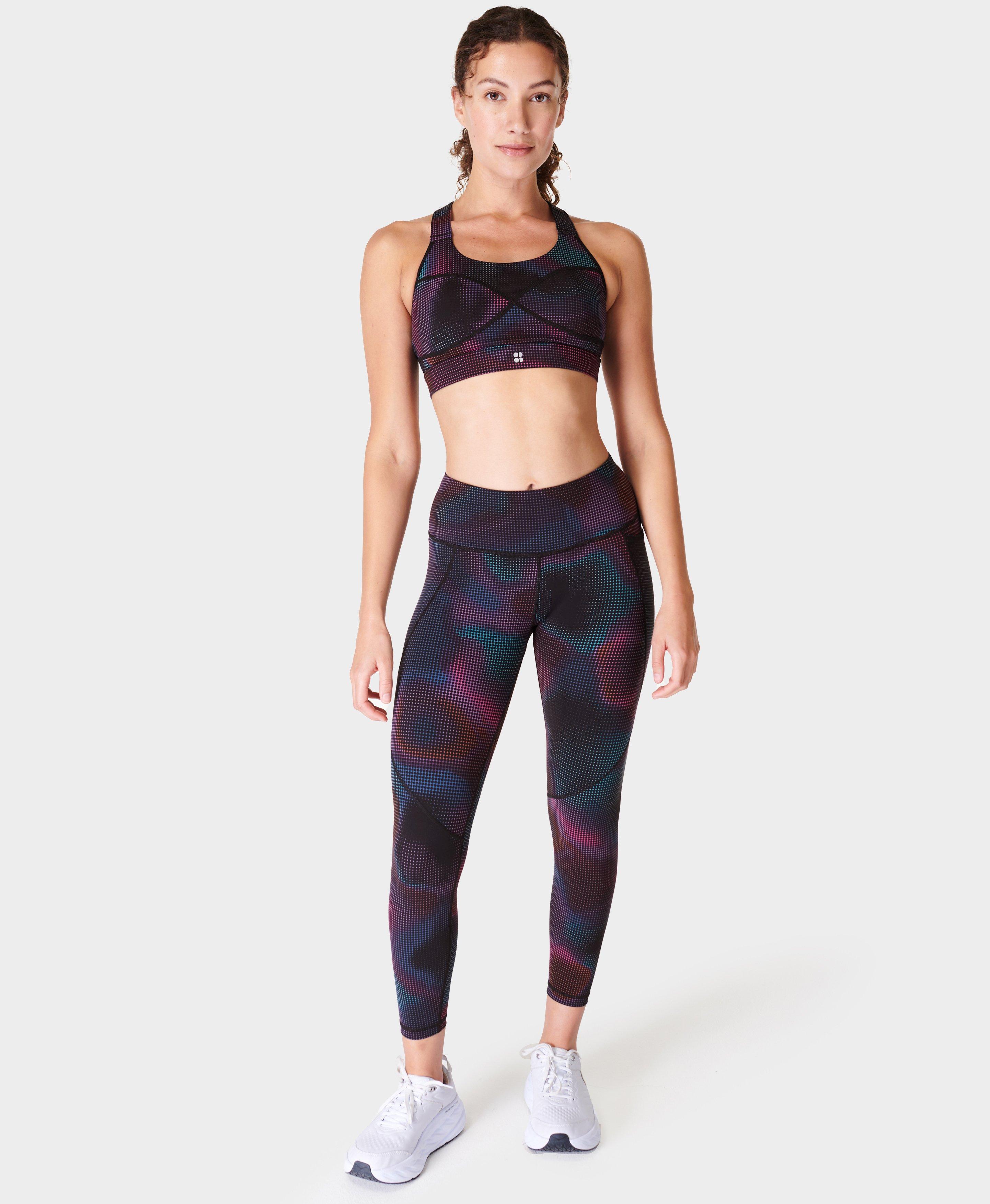 Pink Soda Sport cutout medium support sports bra in black python print