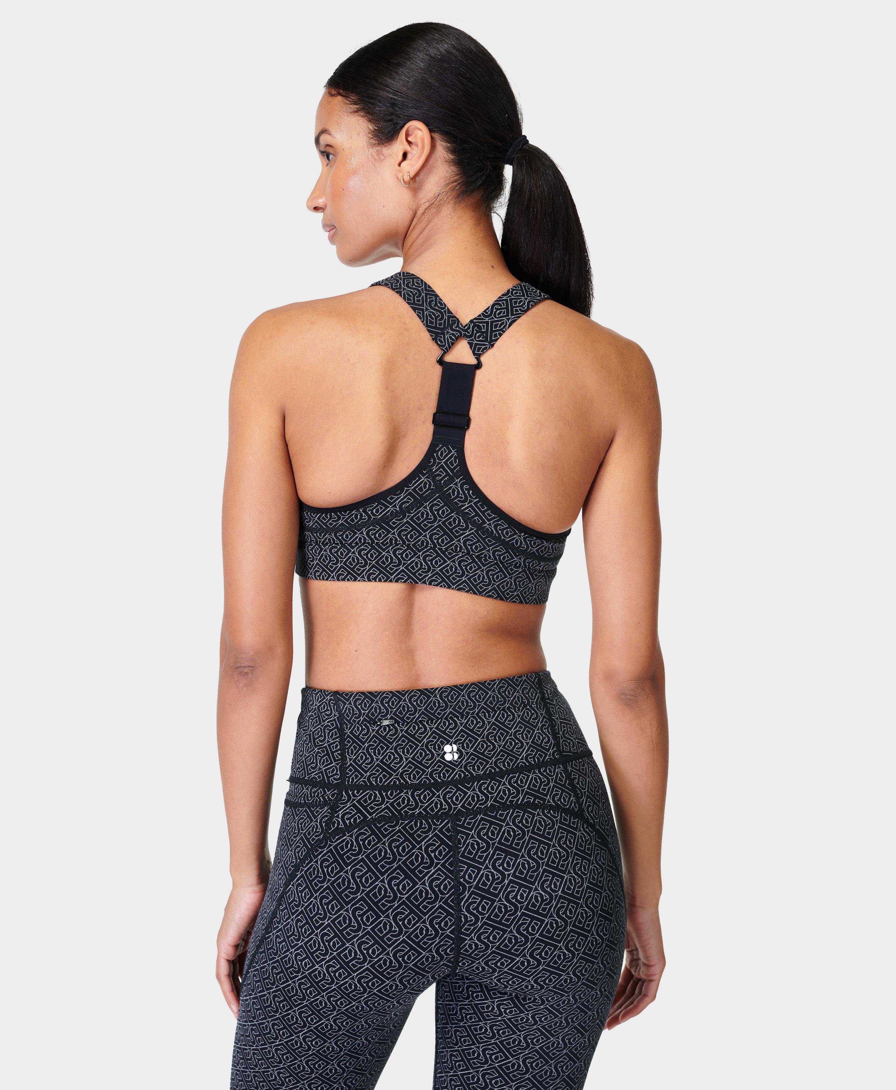 HIIT reflective logo sports bra in black - ShopStyle