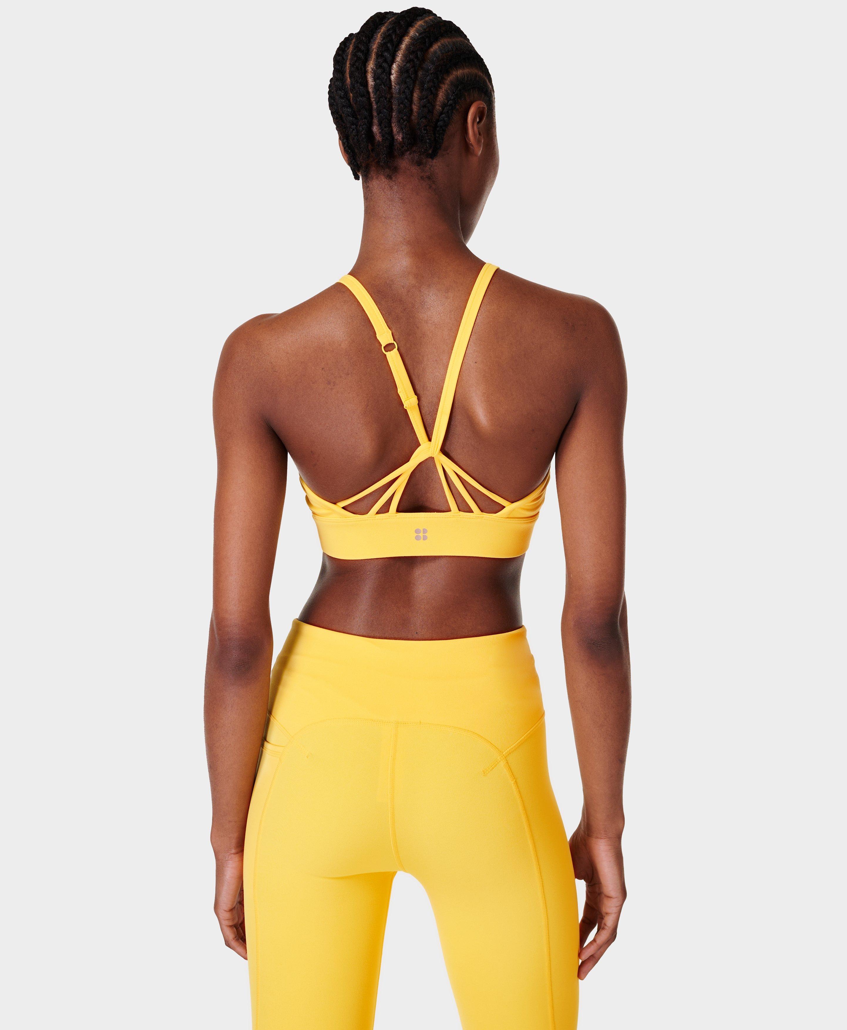 TALA Solasta medium support strappy sports bra in yellow - exclusive to  ASOS