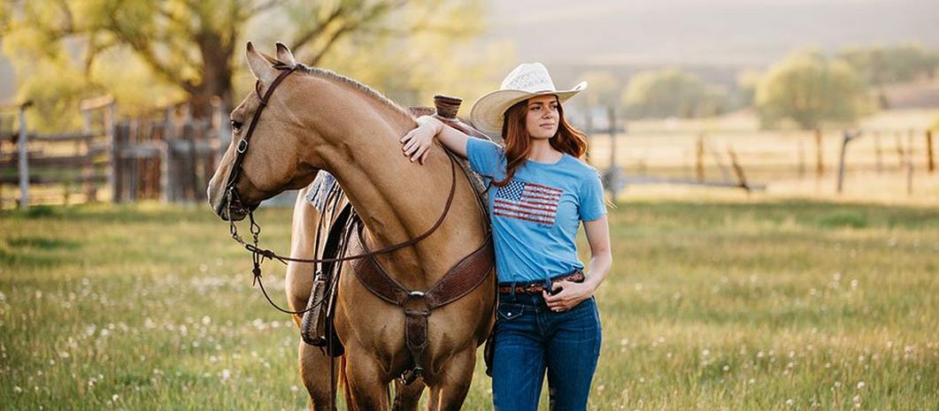 Woman in American Flag T-Shirt by Ariat