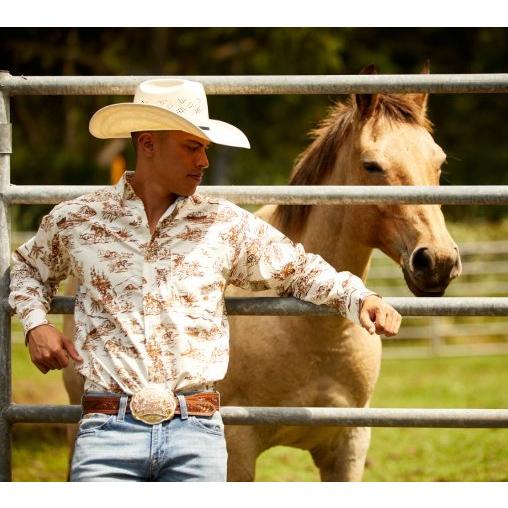 man in ariat shirt standing in front of a horse