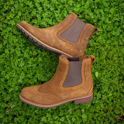 boots in field of grass