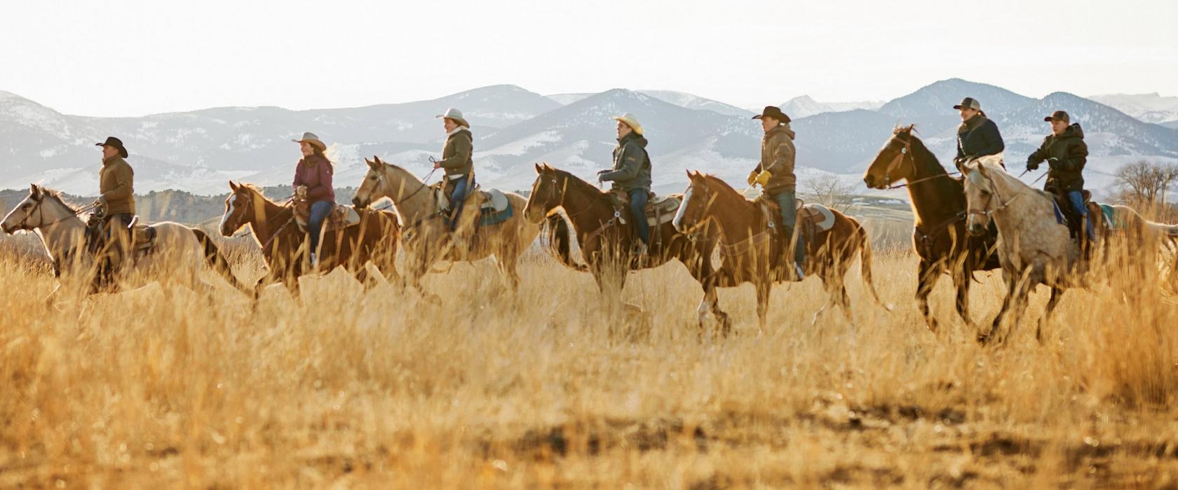 Family on horses in Ariat Clothing and Footwear