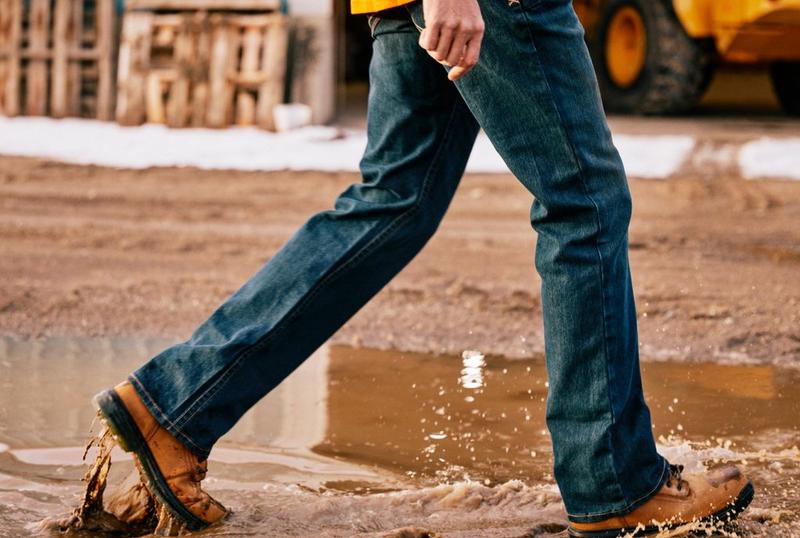 Man walking through mud in Ariat Work Boots