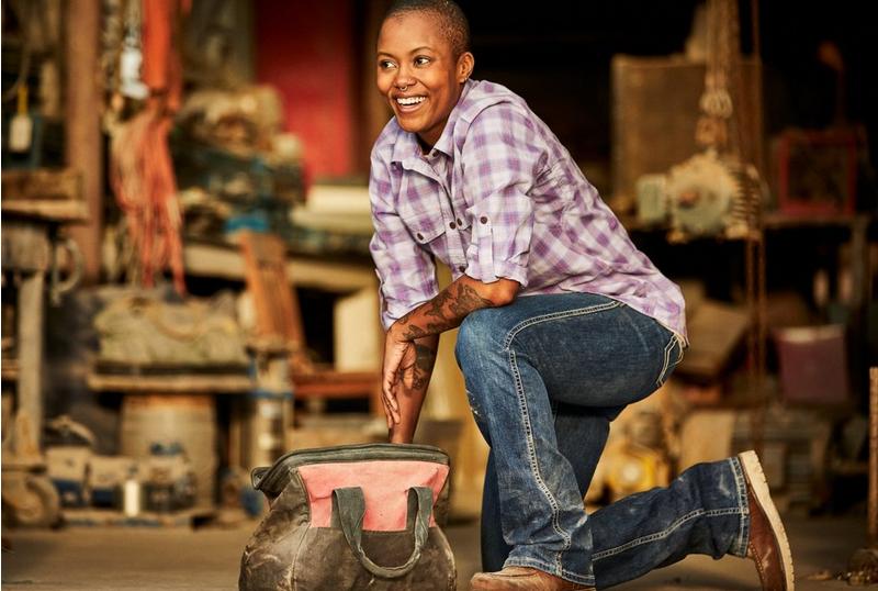 Woman Kneeling in Ariat Work Jeans and Shirt